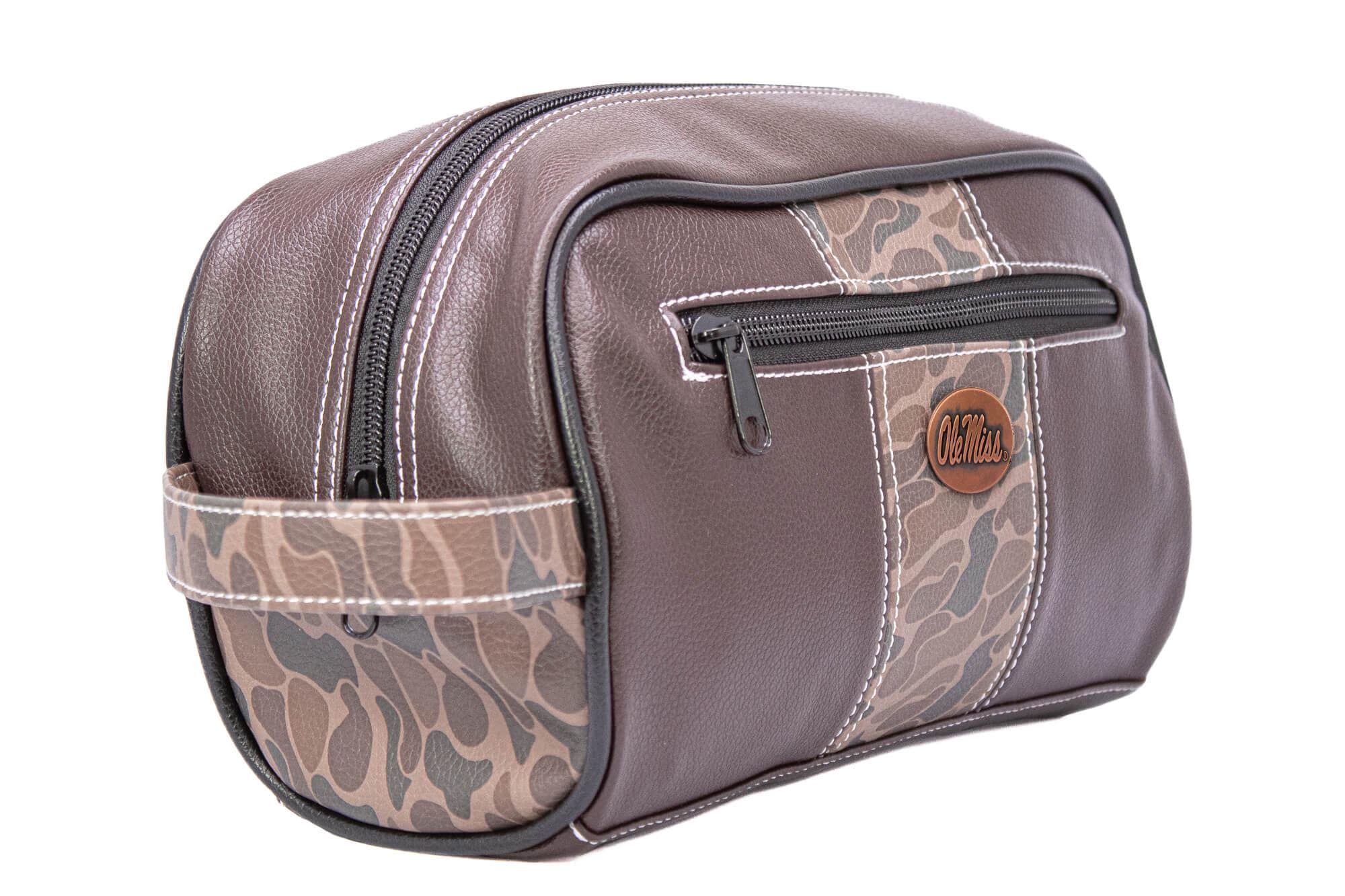 Ole Miss Rebels Men's Camo Dopp Kit. Toiletry Bag. Old School Camo Print. Brown Pebble Finish. Antique Copper Logo. Perfect Travel Accessory
