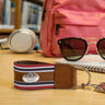 Oklahoma Sooners Collegiate Grosgrain Ribbon Key Chain with Leather Accent and Silver Emblem.