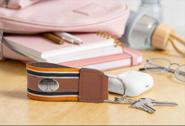 Tennessee Vols Collegiate Grosgrain Ribbon Key Chain with Leather Accent and Silver Emblem.