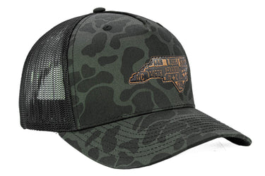 North Carolina Map Old School Camo Trucker Hat. Burnished Full Grain Leather Patch. 5-Panel Richardson 112 Snapback Cap. Stitched Map Patch.