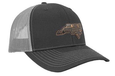 North Carolina Map Leather Patch Trucker Hat. Burnished Full Grain Leather. Snapback Trucker Hat. Richardson 112 Cap. NC Headwear.