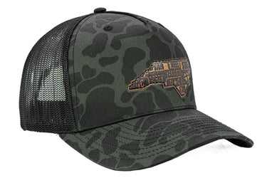 North Carolina Map Old School Camo Trucker Hat. Burnished Full Grain Leather Patch. 5-Panel Richardson 112 Snapback Cap. Stitched Map Patch.